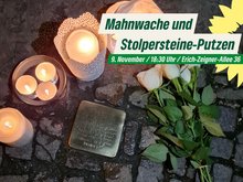 Blumen und Kerzen neben einem Stolperstein